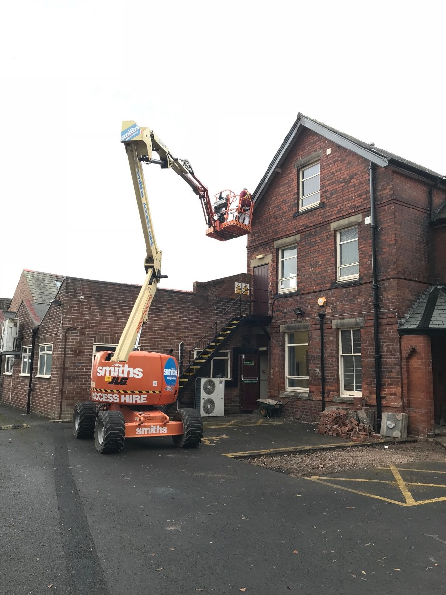 Cherry Picker inspecting the roof Cherry Picker inspecting the roof